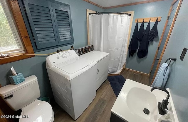 bathroom featuring independent washer and dryer, vanity, wood-type flooring, toilet, and walk in shower