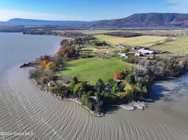 drone / aerial view with a water and mountain view