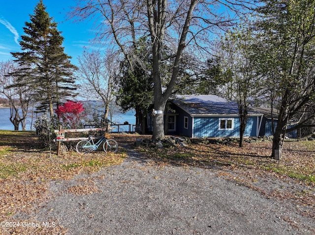 view of front of property with a water view