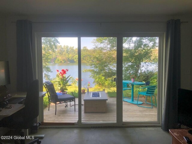 doorway to outside with concrete flooring and plenty of natural light