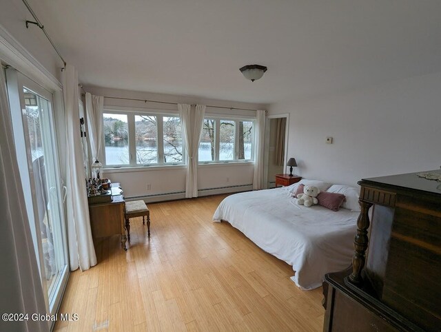 bedroom with light hardwood / wood-style floors