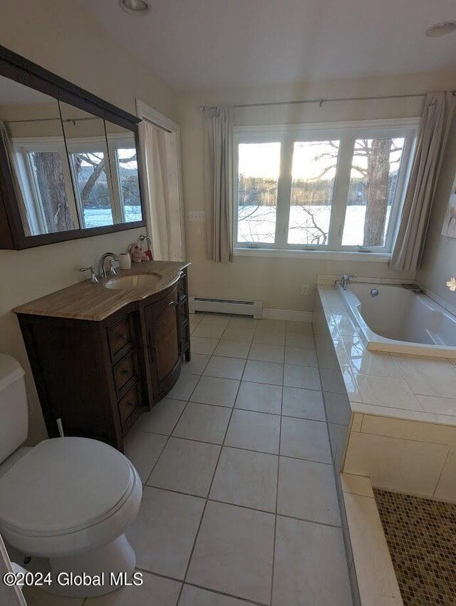 bathroom with vanity, a baseboard radiator, toilet, and a healthy amount of sunlight