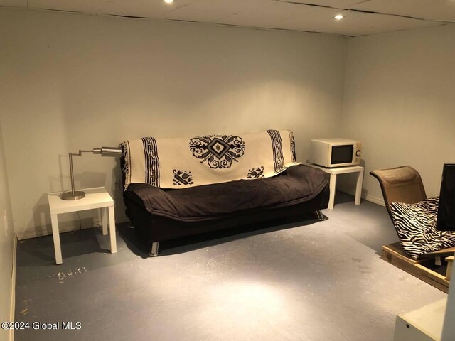 bedroom featuring concrete floors