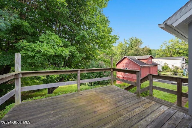 wooden terrace with an outdoor structure