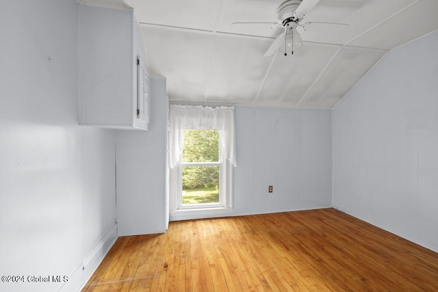 additional living space with ceiling fan, light wood-type flooring, and lofted ceiling