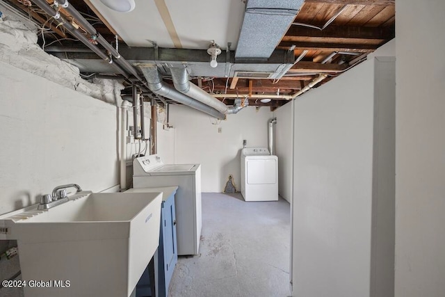 interior space with washing machine and dryer and sink