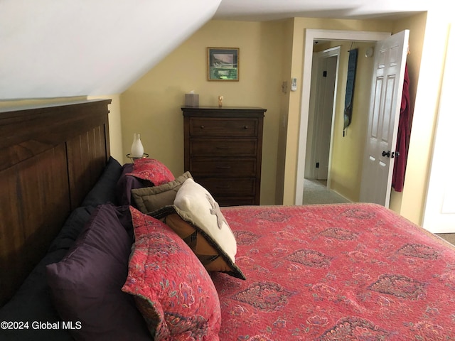 bedroom featuring lofted ceiling