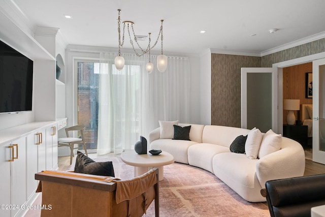 living room with ornamental molding and wallpapered walls