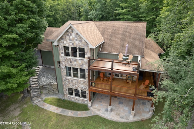 rear view of property with a patio and a deck