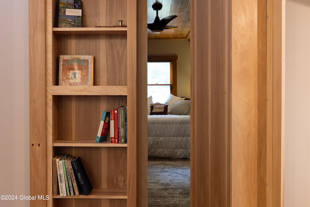 hallway with hardwood / wood-style floors