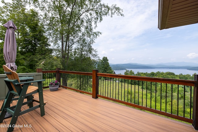 deck featuring a water and mountain view