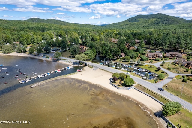 aerial view featuring a water and mountain view