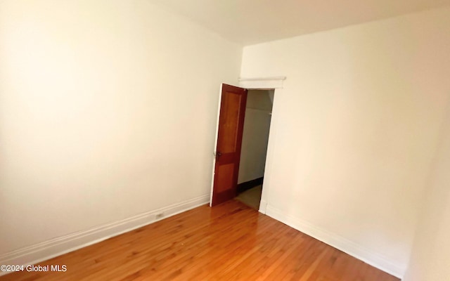 empty room featuring hardwood / wood-style flooring