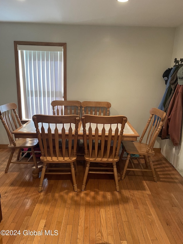 dining room with hardwood / wood-style floors