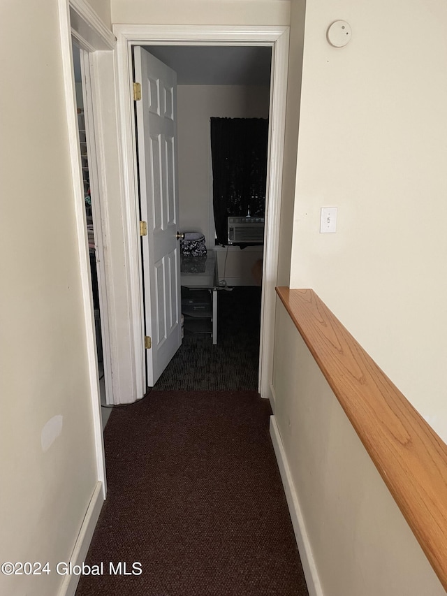 hallway featuring carpet flooring and cooling unit