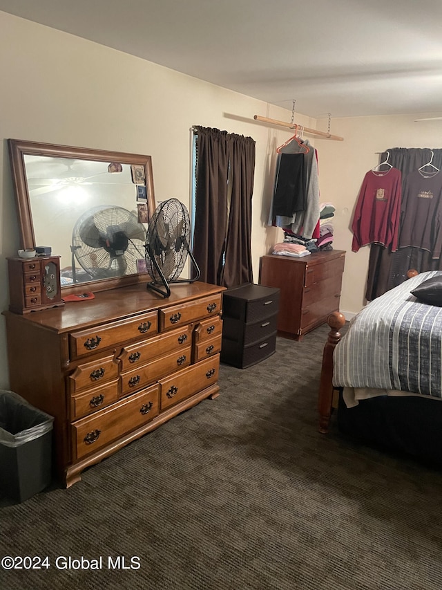 bedroom with dark carpet