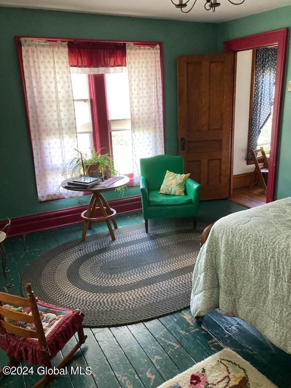 bedroom with wood-type flooring