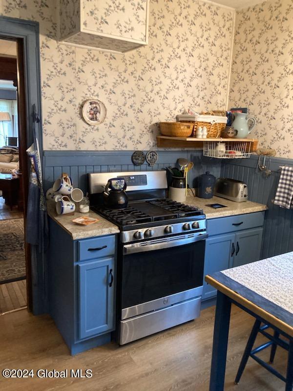 kitchen featuring hardwood / wood-style floors and gas stove