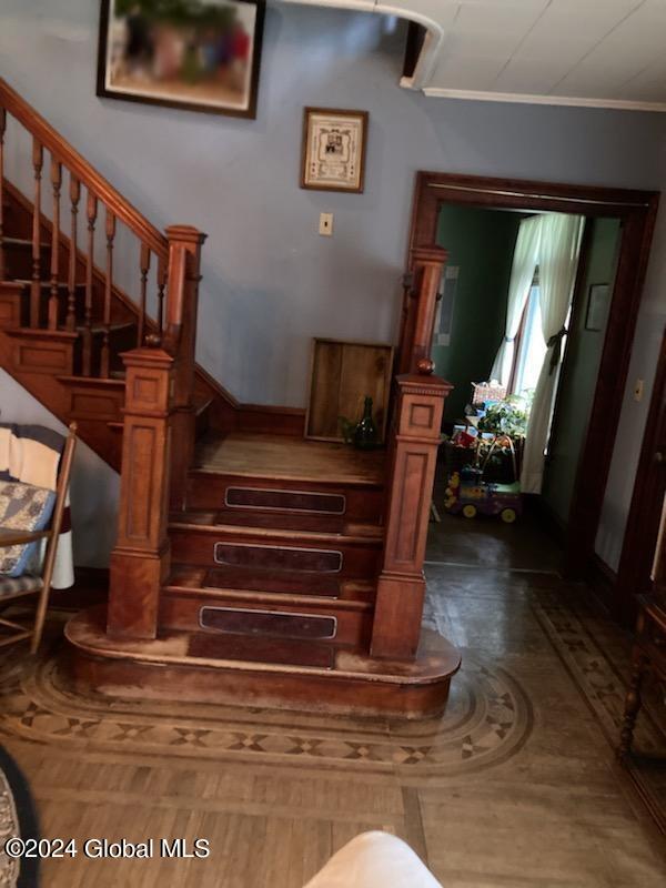 stairs with crown molding