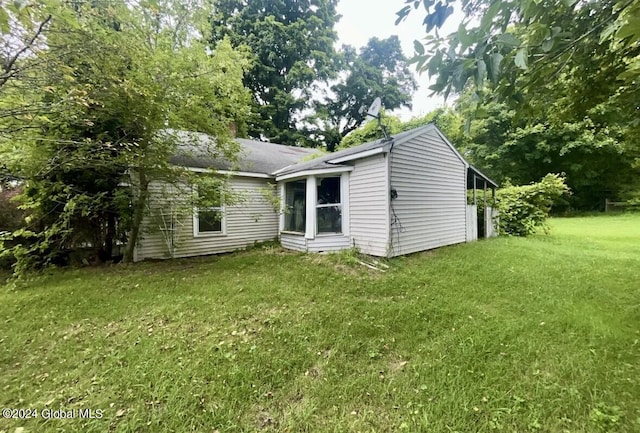 back of house with a yard