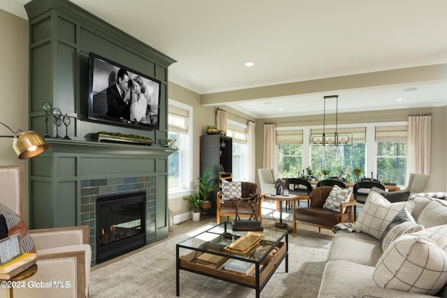 living room featuring crown molding and a brick fireplace