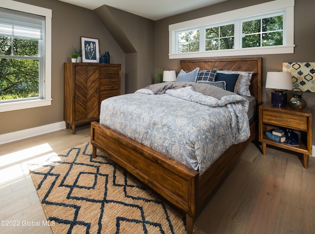 bedroom with light wood-type flooring