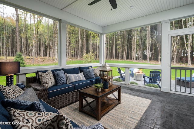 sunroom featuring ceiling fan