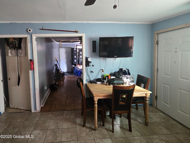 dining space featuring crown molding and ceiling fan