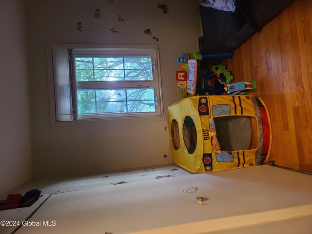 recreation room with wooden walls