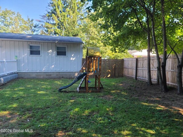 21 Foxhall Dr, Saratoga Springs, NY 12866 - view of yard featuring a fenced backyard and a playground