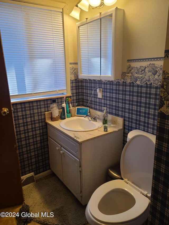 21 Foxhall Dr, Saratoga Springs, NY 12866 - bathroom featuring wallpapered walls, vanity, toilet, and visible vents