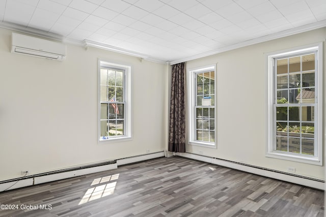 unfurnished room featuring ornamental molding, a wall mounted air conditioner, light hardwood / wood-style flooring, and a wealth of natural light