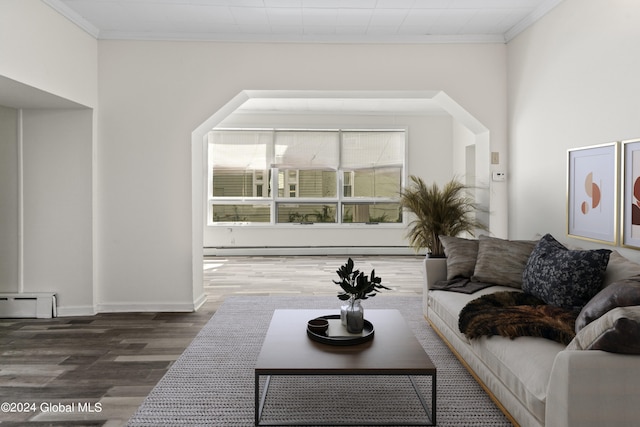 living room featuring ornamental molding, dark hardwood / wood-style flooring, and baseboard heating