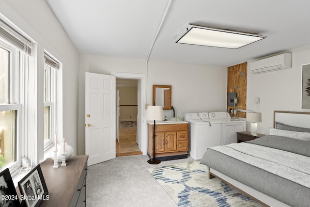 carpeted bedroom featuring multiple windows, washer and clothes dryer, electric panel, and an AC wall unit