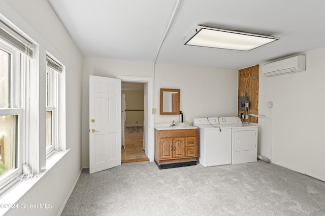 laundry room with a wall unit AC, independent washer and dryer, cabinets, electric panel, and light carpet