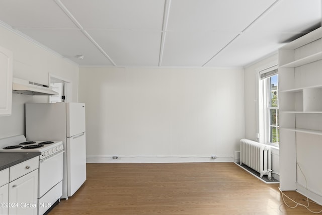 kitchen featuring radiator, hardwood / wood-style floors, white cabinets, and white range with electric stovetop