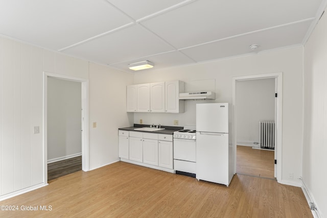 kitchen with sink, white appliances, radiator heating unit, white cabinets, and light wood-type flooring