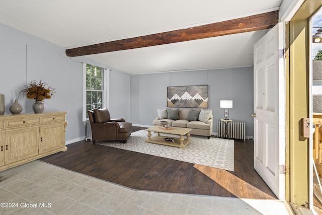 living room with beamed ceiling, radiator, and hardwood / wood-style floors