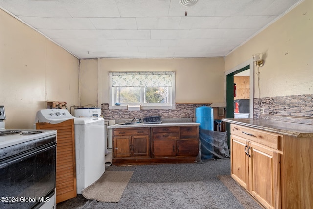 clothes washing area featuring washer / dryer and dark colored carpet