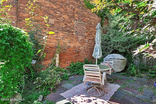 view of patio featuring a grill