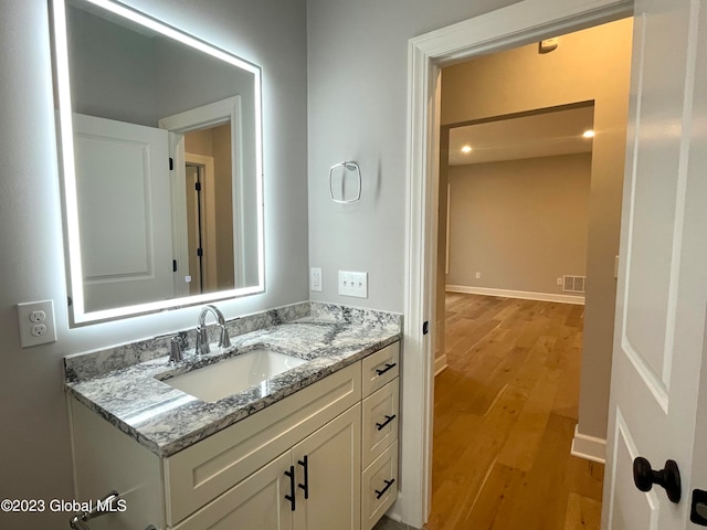 bathroom featuring vanity and wood-type flooring