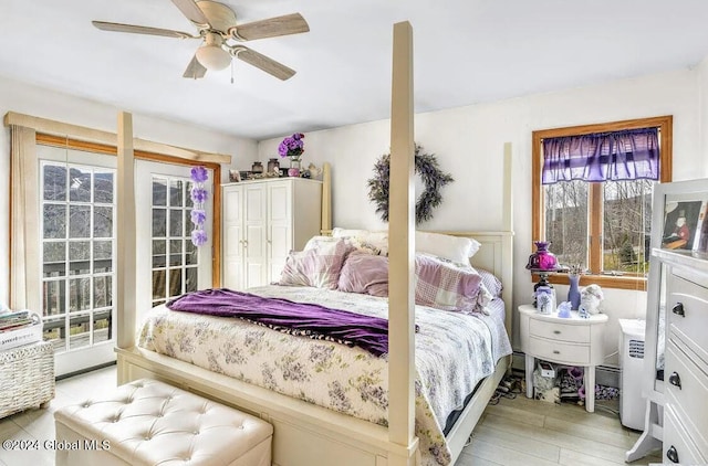 bedroom featuring ceiling fan and light hardwood / wood-style flooring