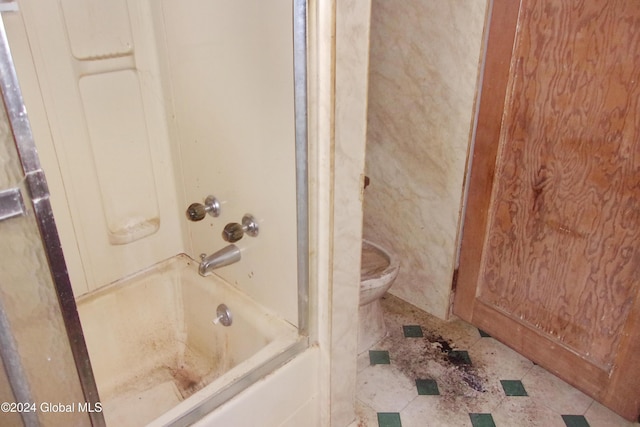 bathroom featuring toilet and shower / tub combination