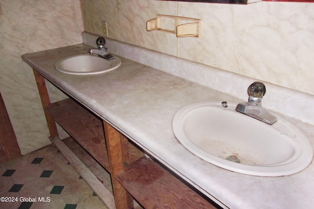 bathroom with tile patterned floors and vanity