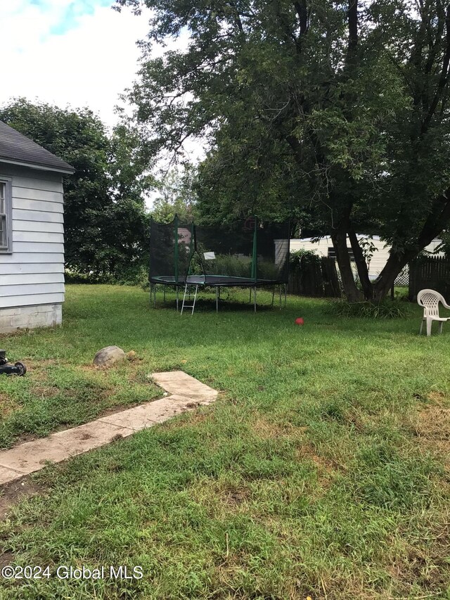 view of yard with a trampoline