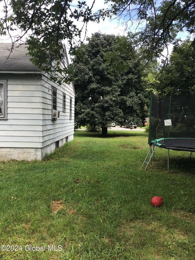 view of yard featuring a trampoline