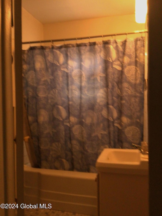 bathroom featuring shower / tub combo with curtain and vanity