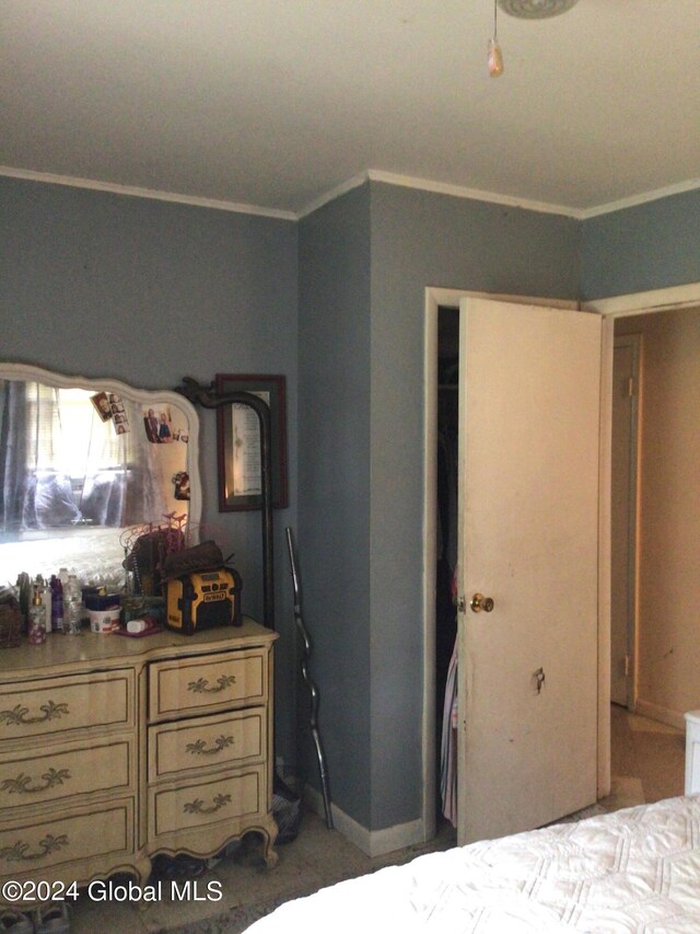 bedroom featuring crown molding