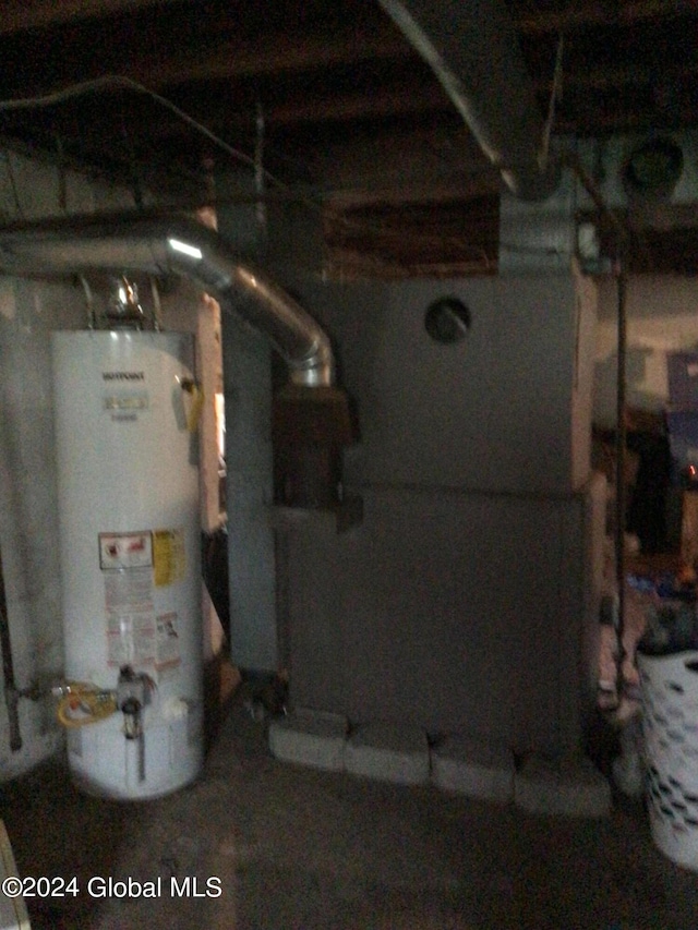 utility room featuring gas water heater