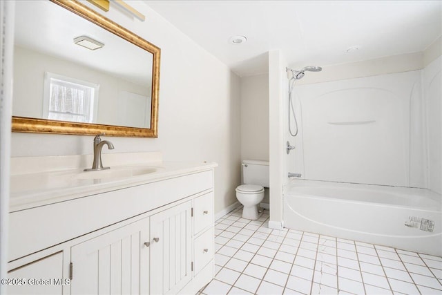 full bathroom with tile patterned floors, toilet, washtub / shower combination, baseboards, and vanity